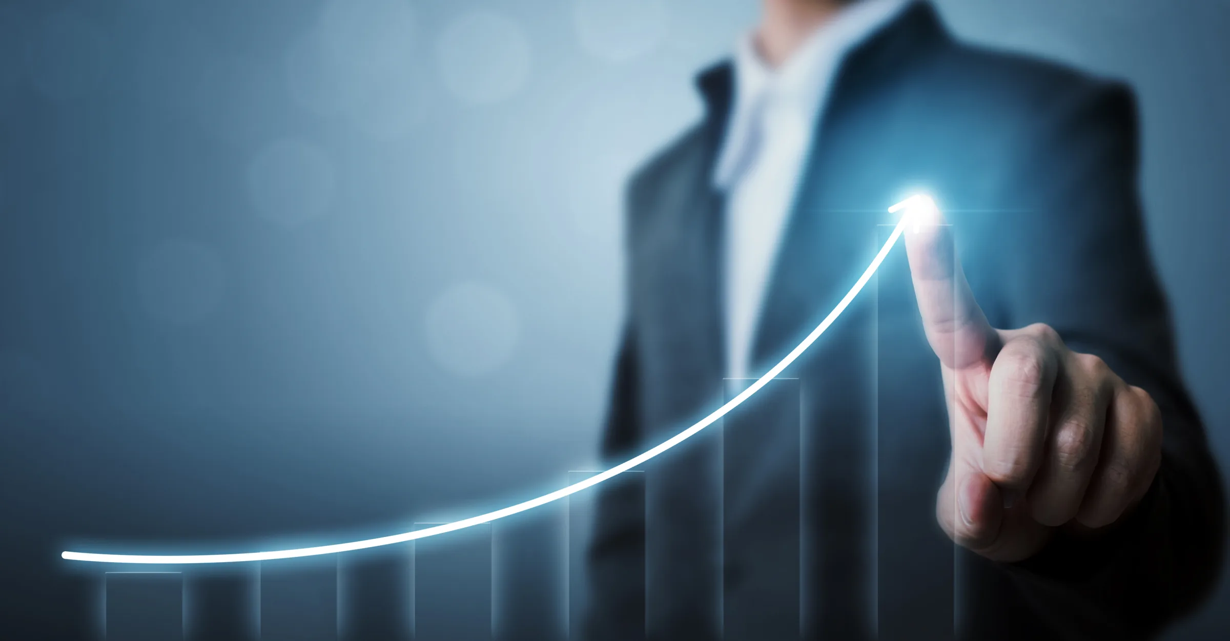 An executive tracing a rising growth curve